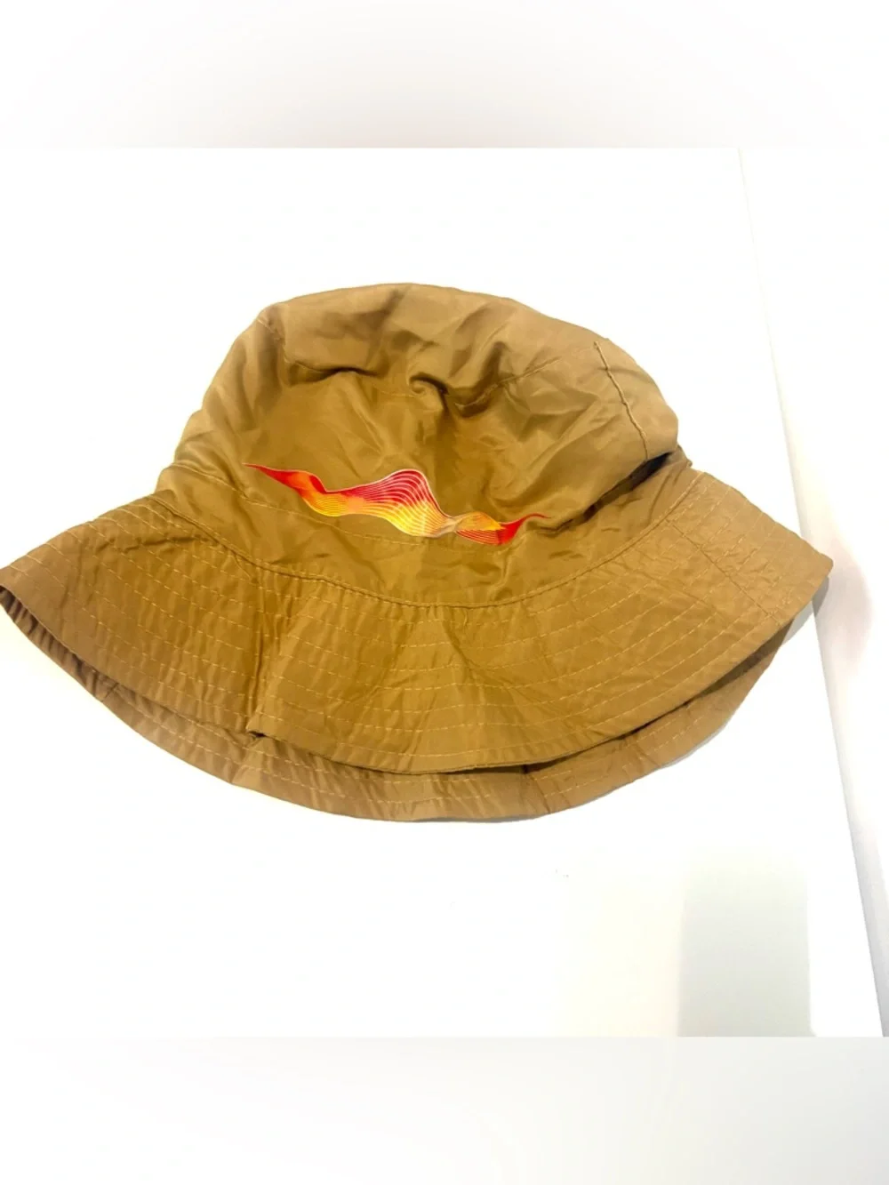 Lightweight Brown Bucket Hat with Red-Orange Wave Detail Never used